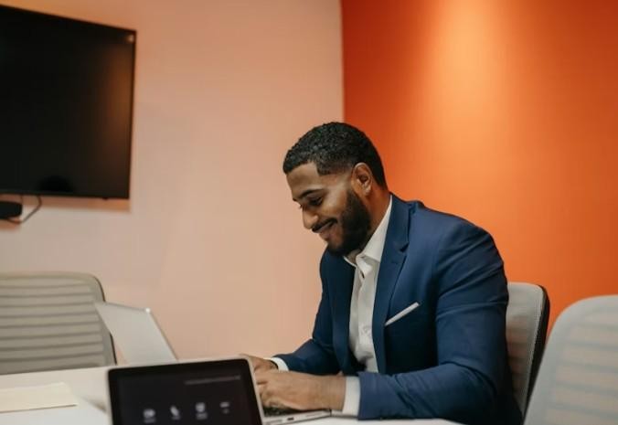 People working on laptops in a modern tech environment